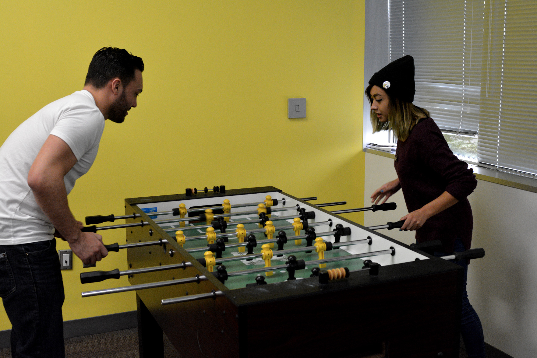 joe playing foosball